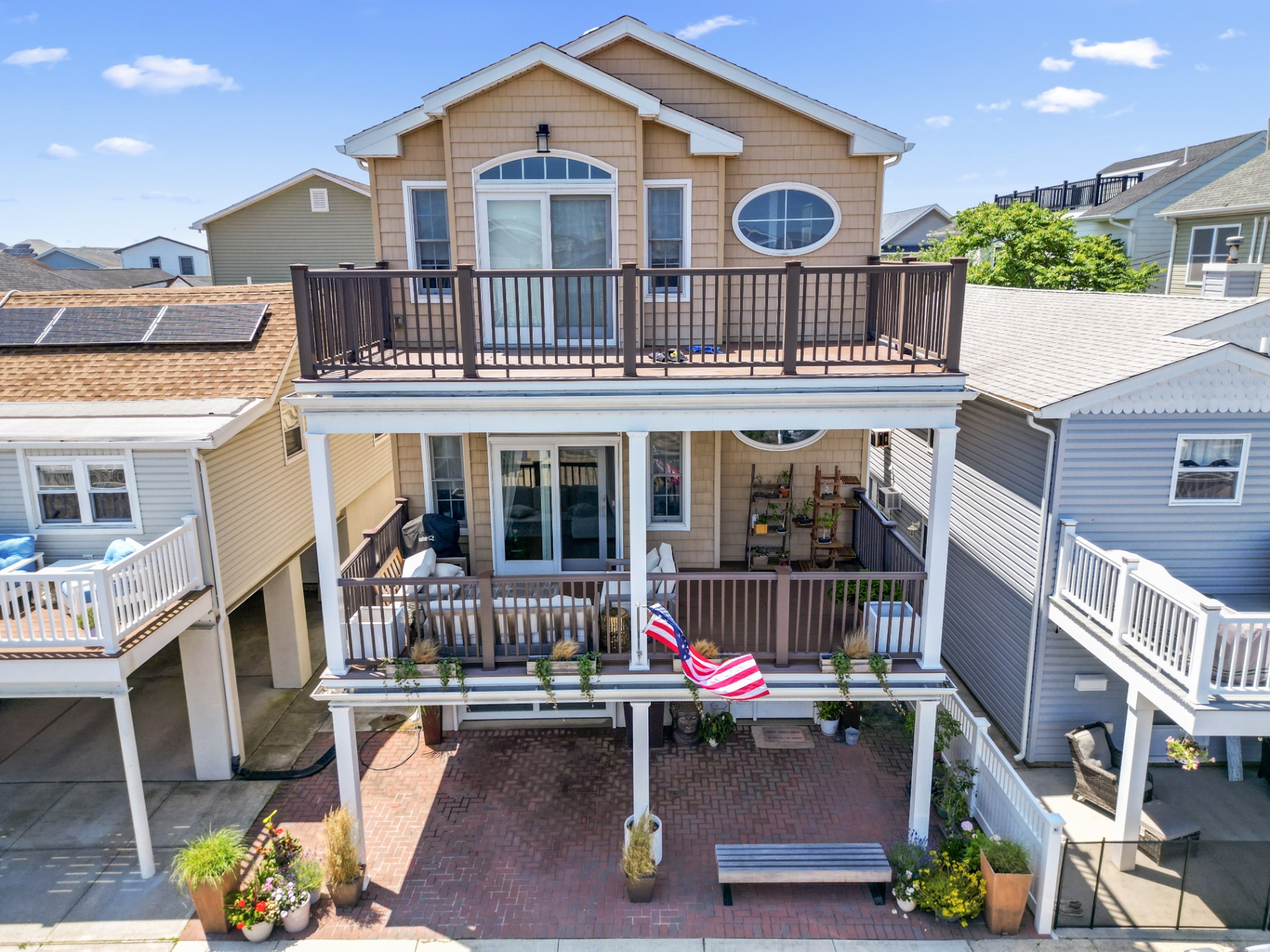 Drone photograph of a rooftop deck and neighboring coastal homes in Long Beach New York